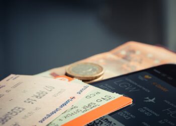orange and green label airplane ticket